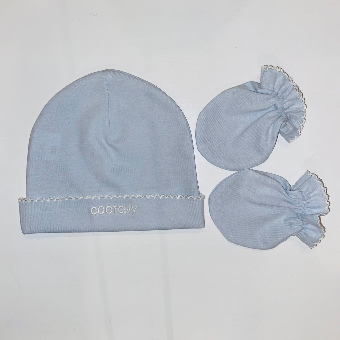 Conjunto de gorro y manopla celeste picueta