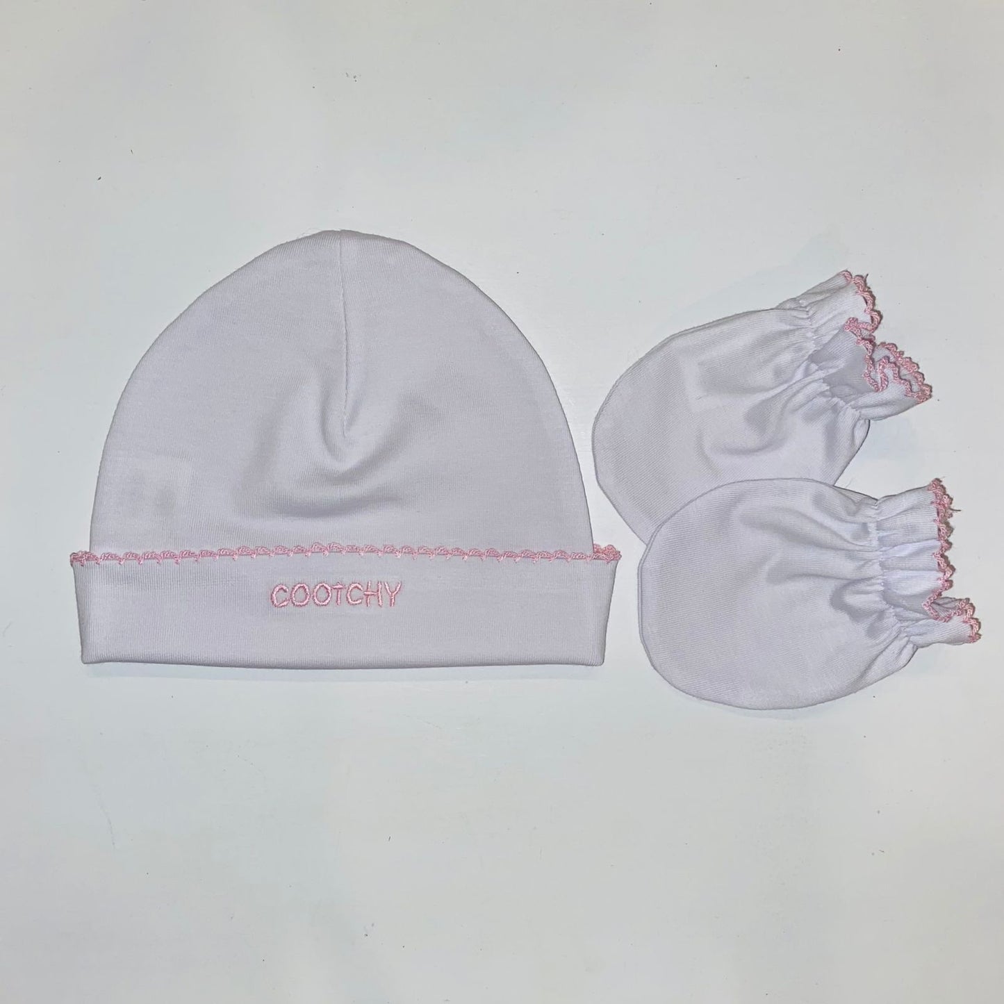 Conjunto de gorro y manopla blanco picueta rosa
