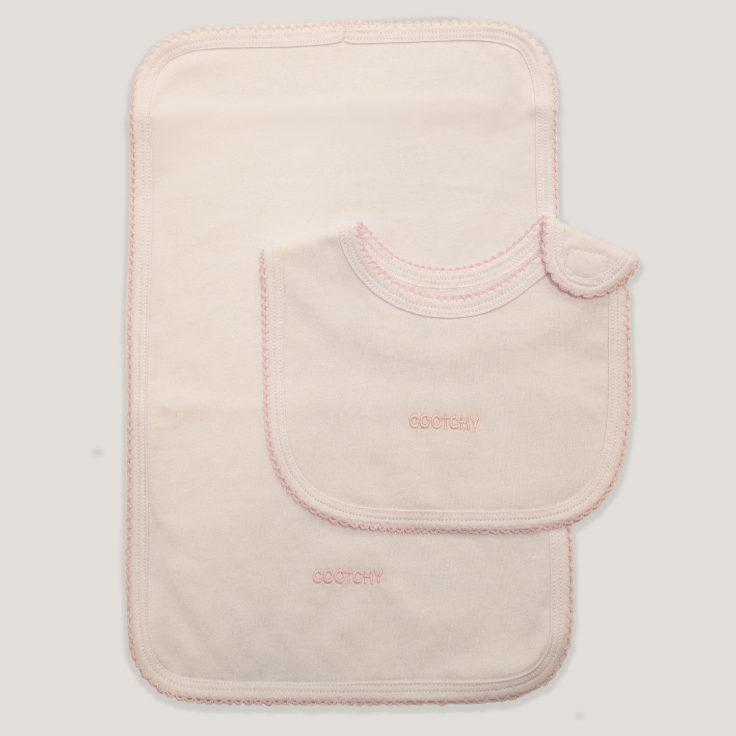 Conjunto babero y toallita picueta rosa
