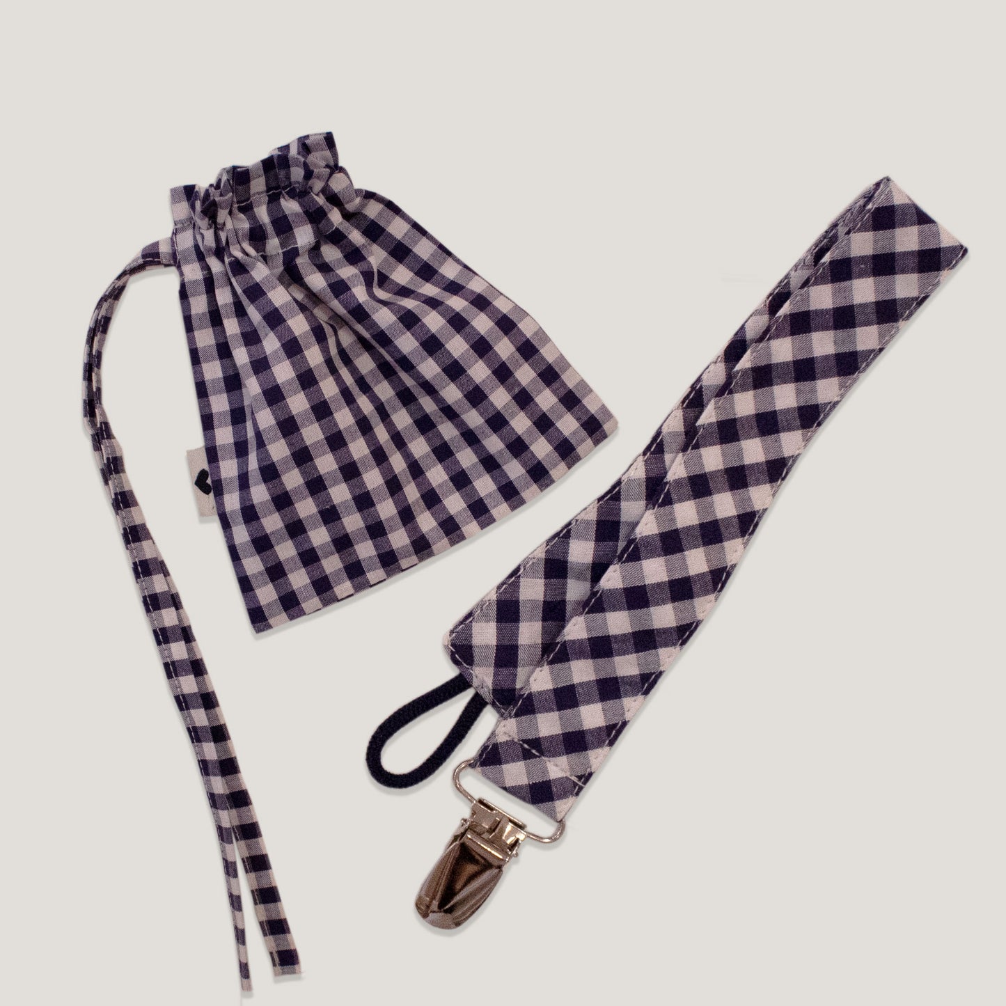 Bolsita + porta chupete cuadritos azul