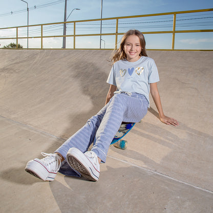 Pantalon buzo con corazon rayas celeste